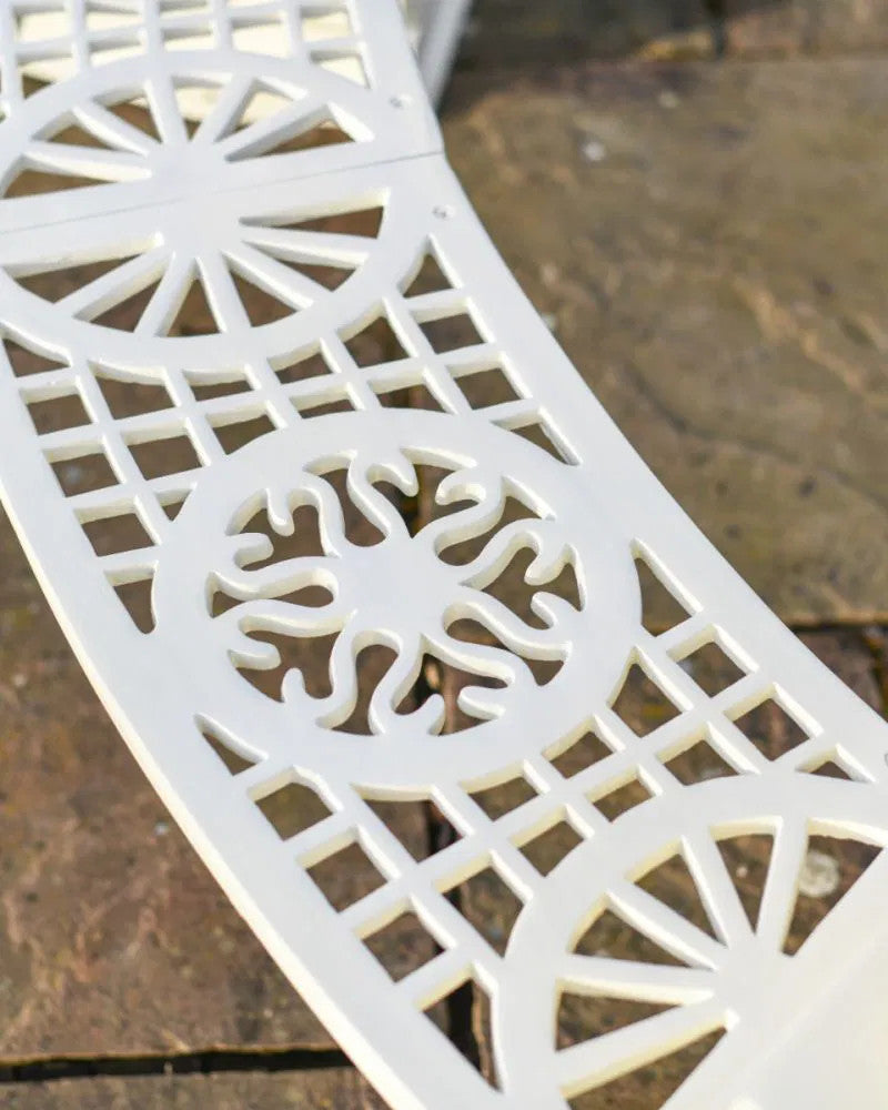 View of the detailed artwork on the cream bench