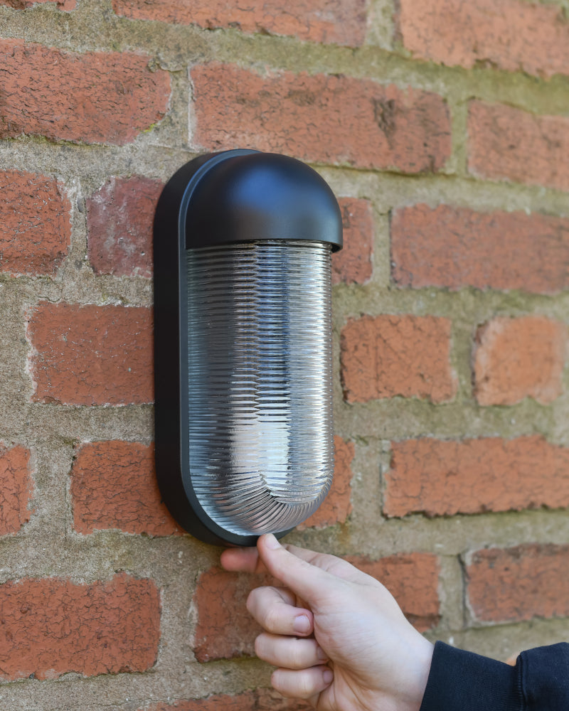 Life size scale of the 'Crewood' Contemporary Cylinder Wall Light