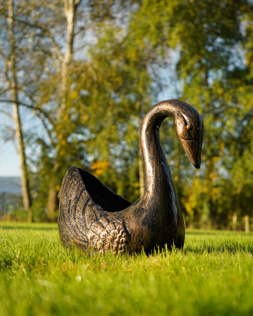 Copper-coloured swan planter 