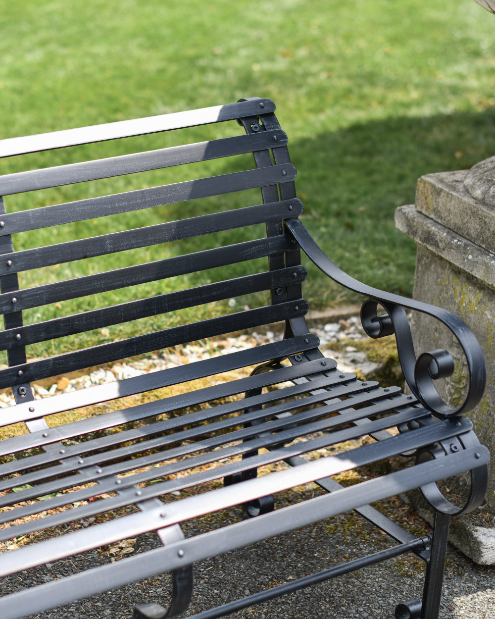 Antique black park bench 