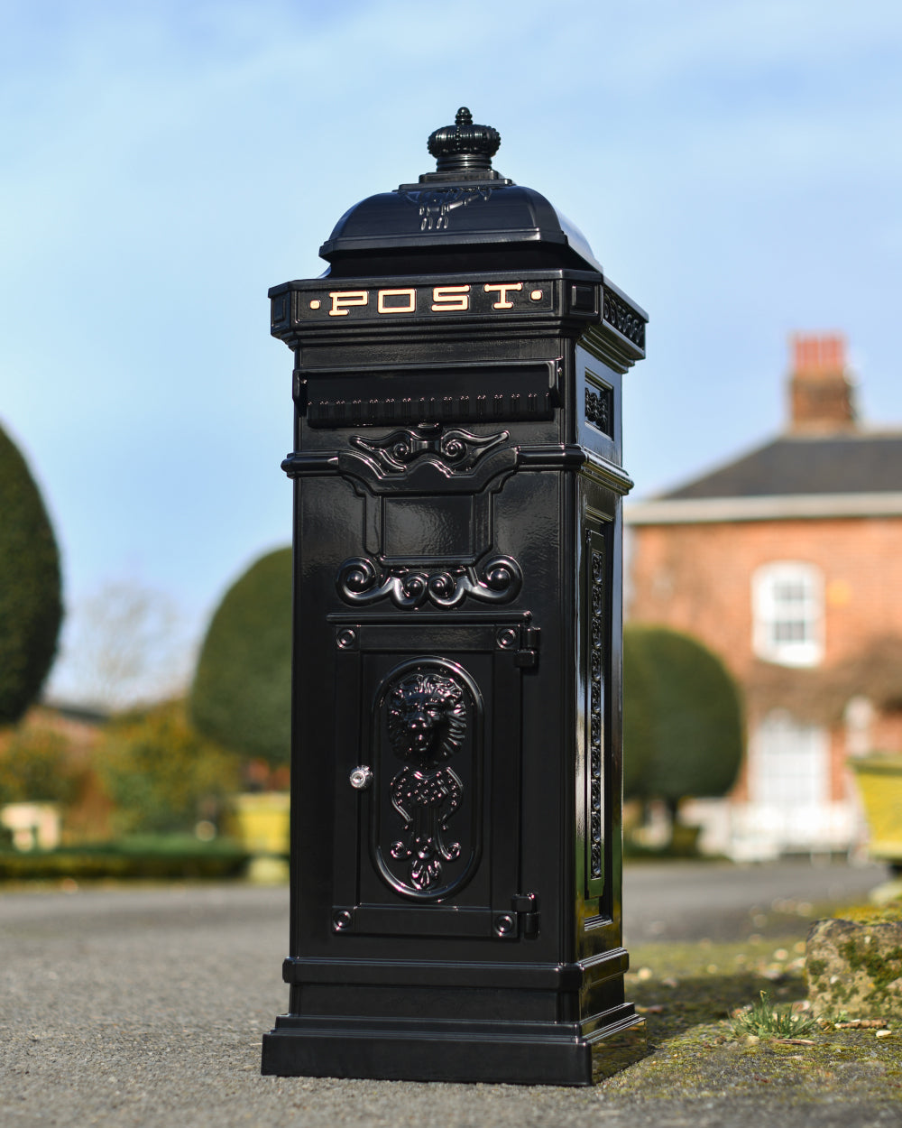 Freestanding black post box 
