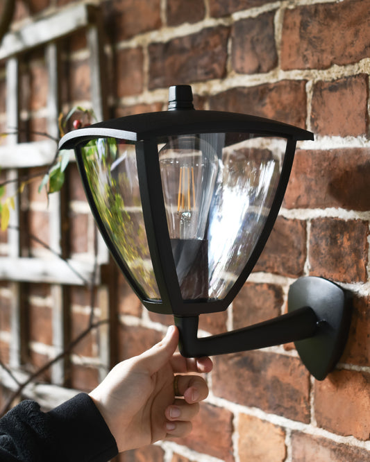Garden wall light fixed to the front of a house 