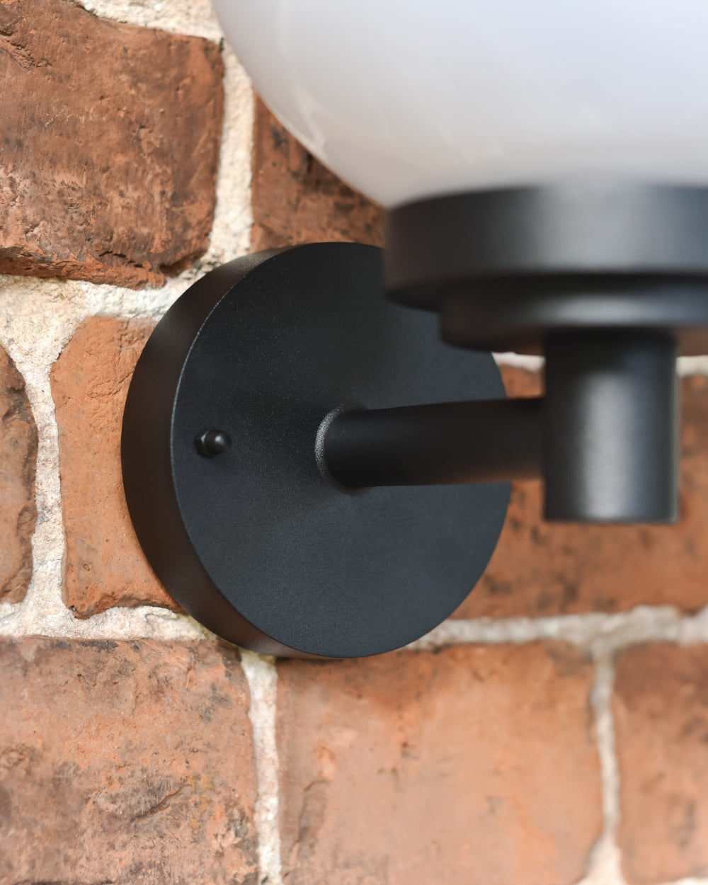 Matte-black bracket fixed to the wall 