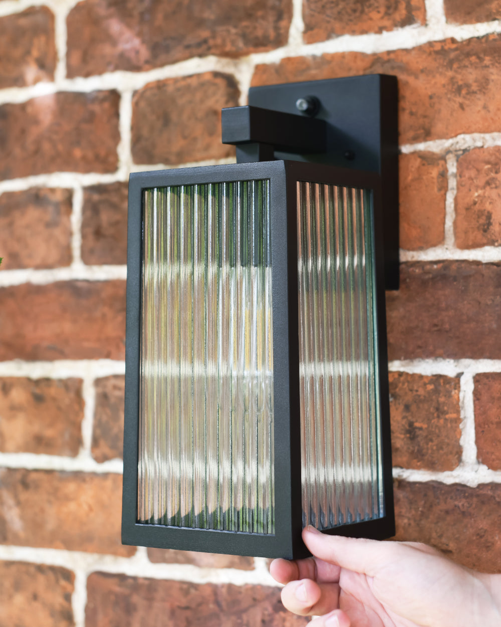 Wall light with ribbed glass 