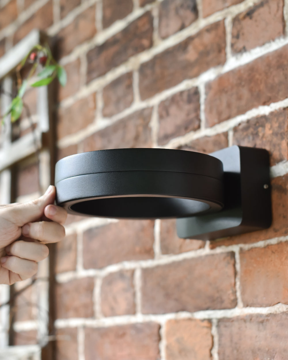 Exterior light on a brick wall