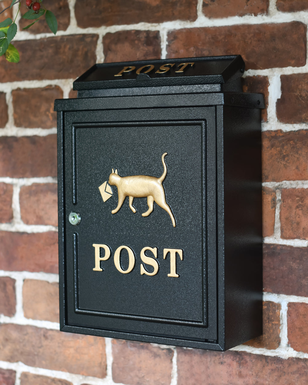 Black and gold post box