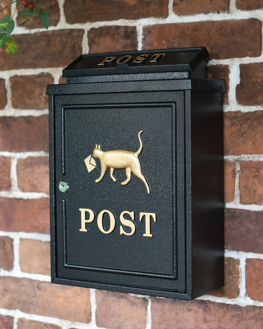 Black and gold post box