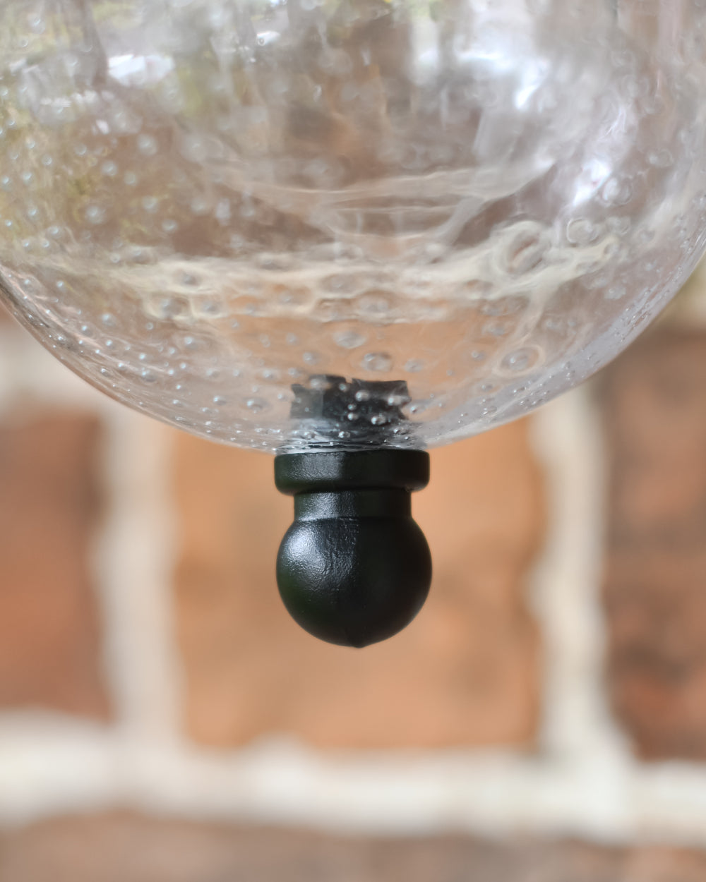Seeded glass on wall-mounted garden light