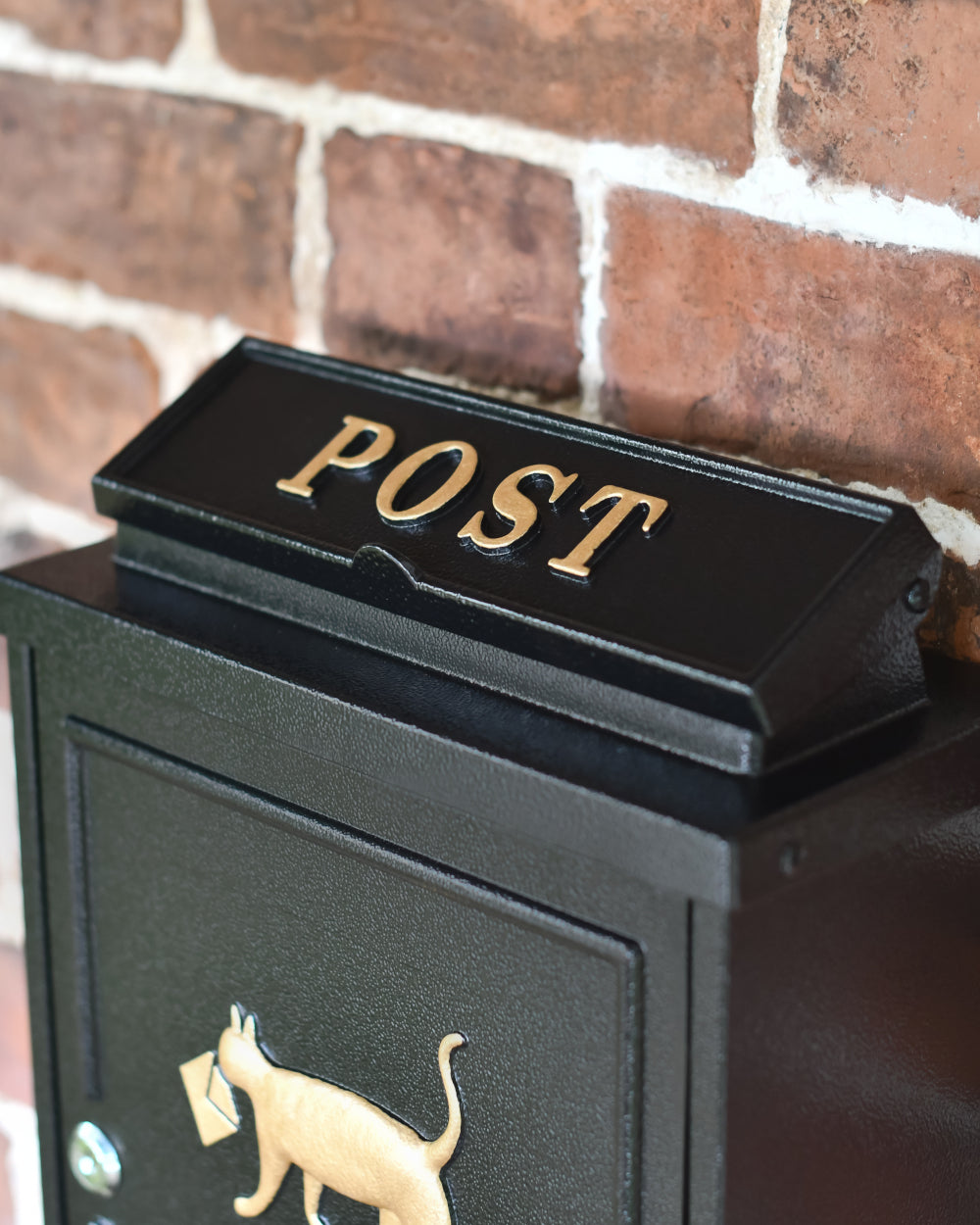 Post box with golden lettering 