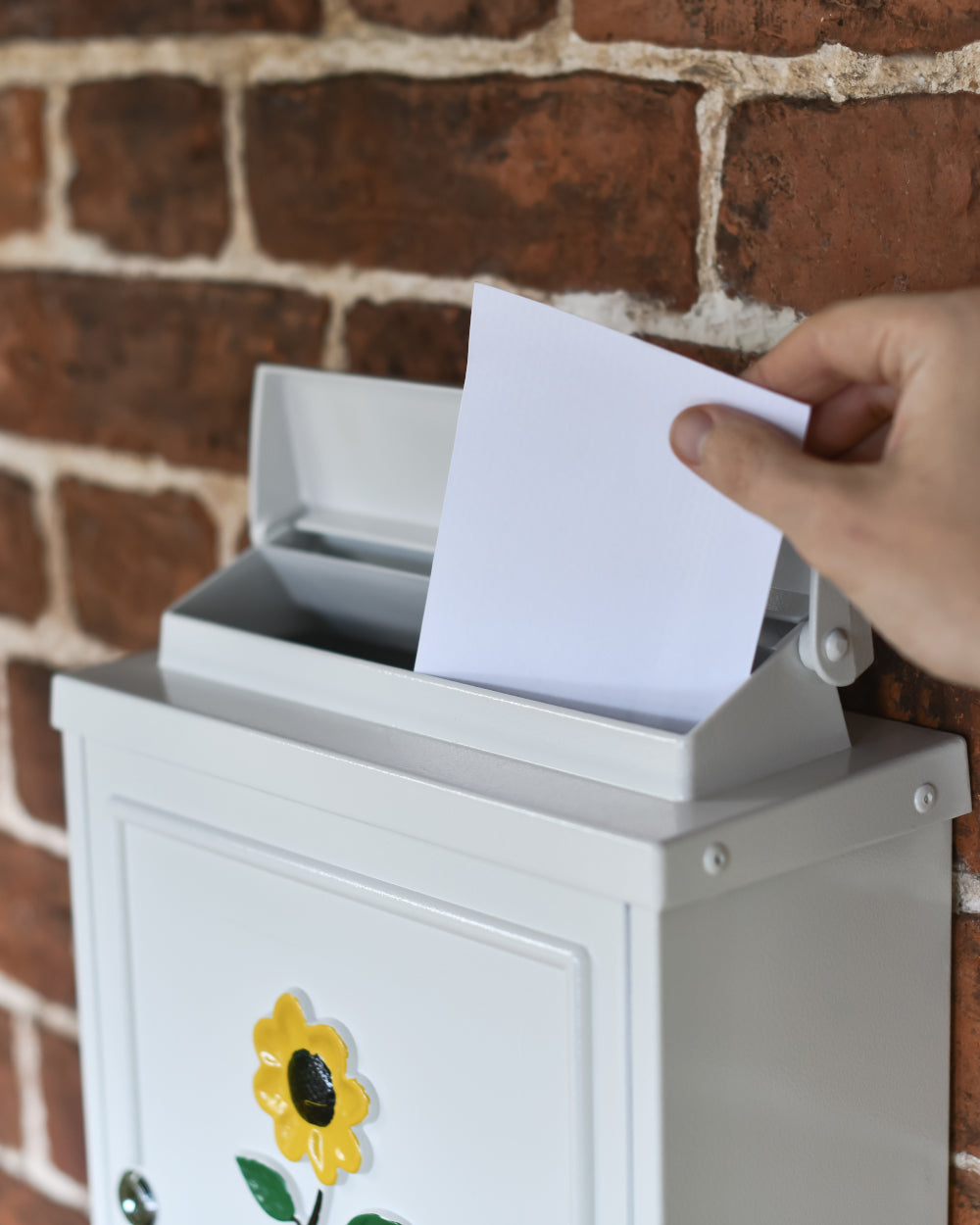 Postage box with liftable aperture 