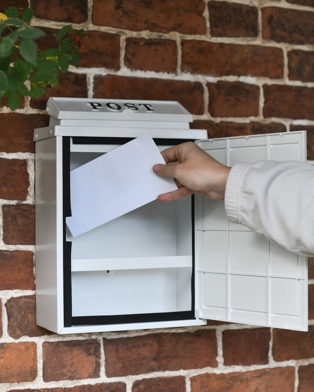 Post box with hinged doors 