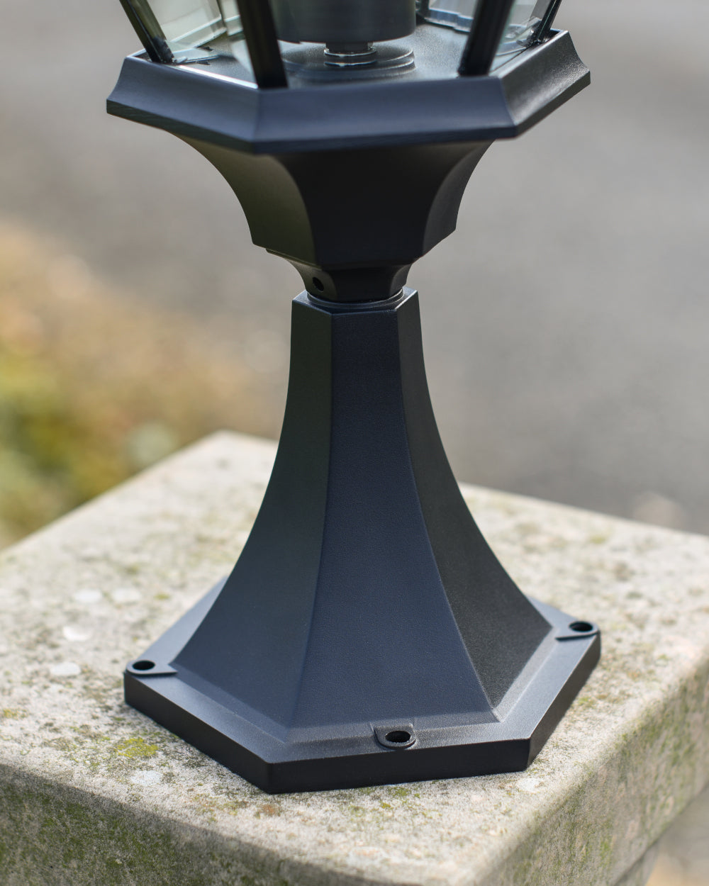 Black hexagonal base with fixings 