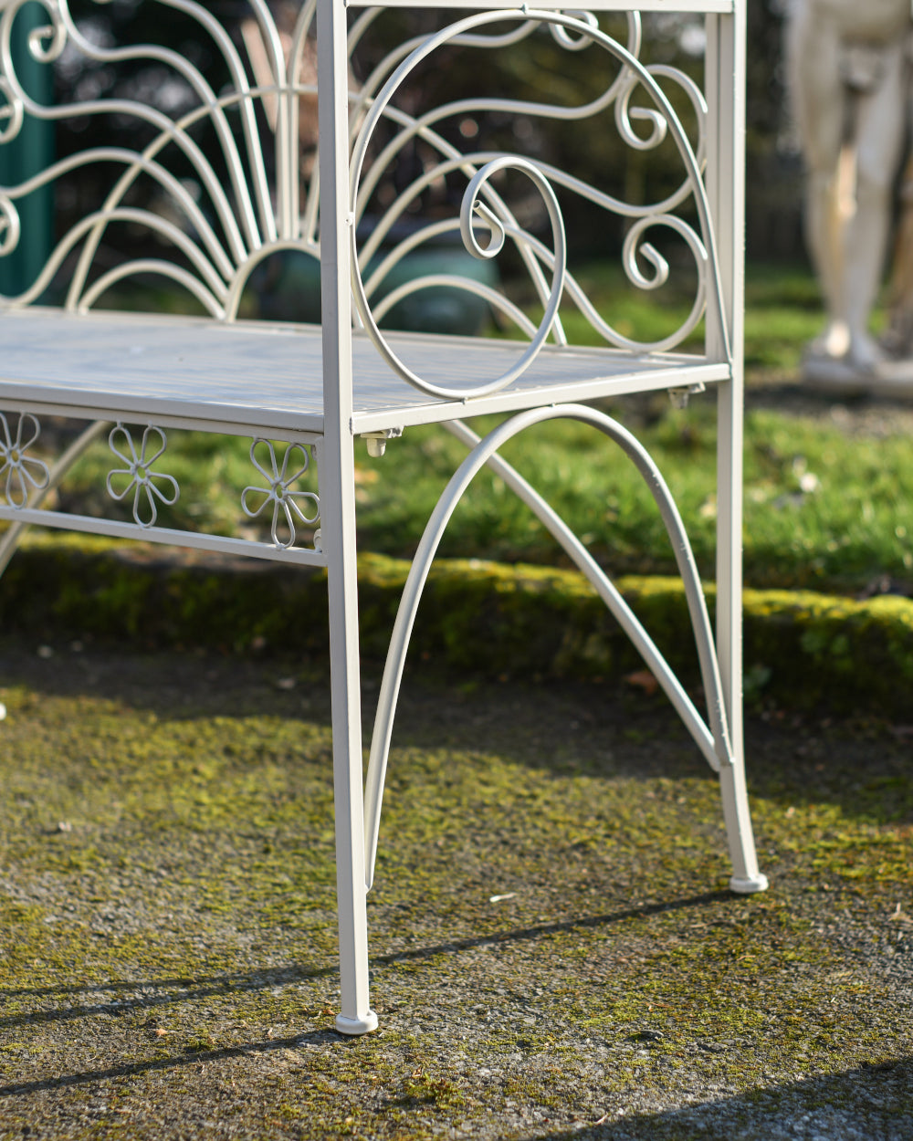 Curved cream garden bench 