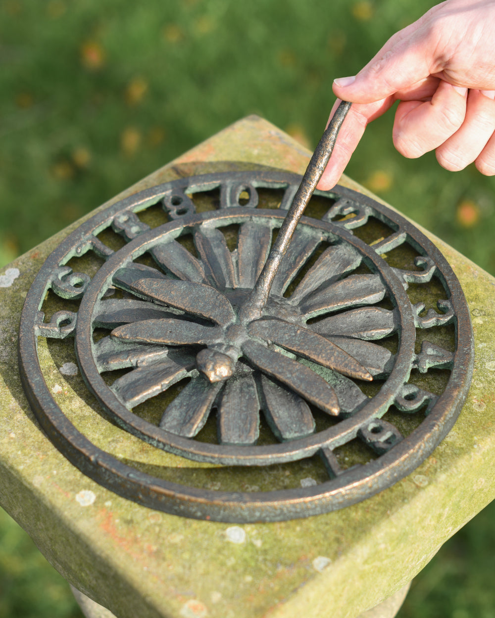 Life-size scale of rustic sundial 
