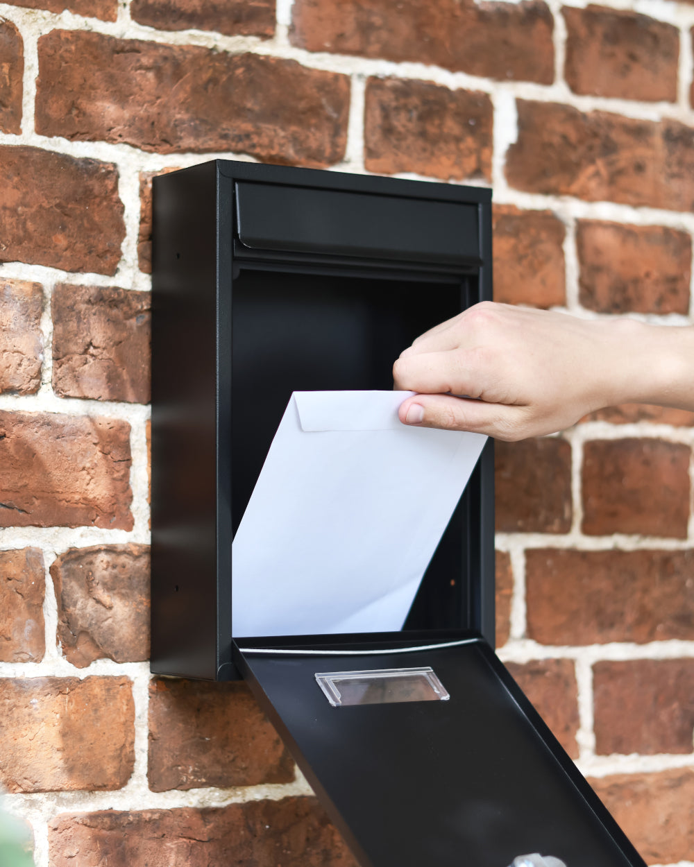 Retractable door post box 