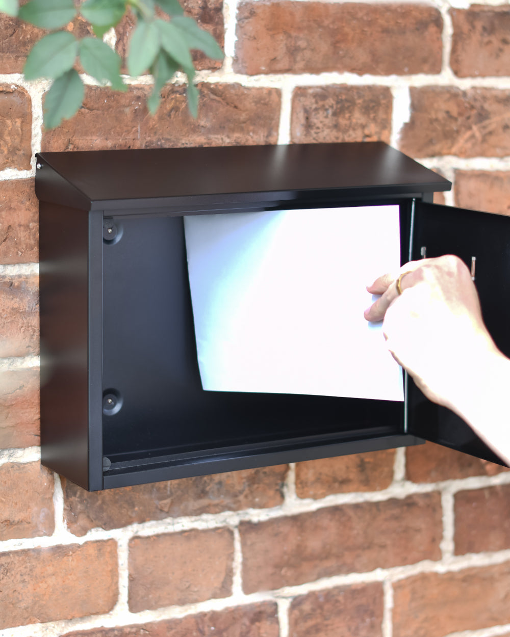 Post box with a large opening hinged door 