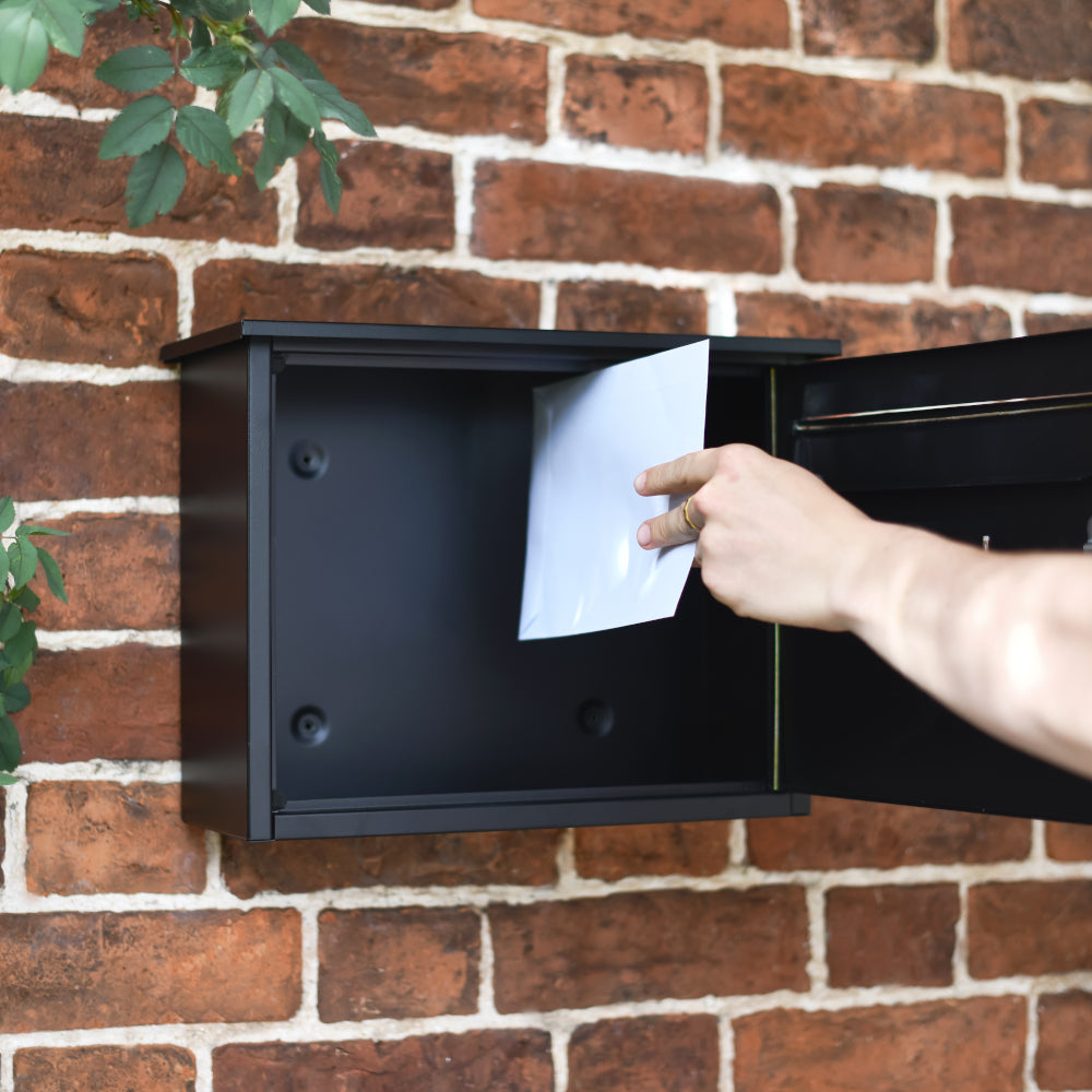 Post box with hinged front door 
