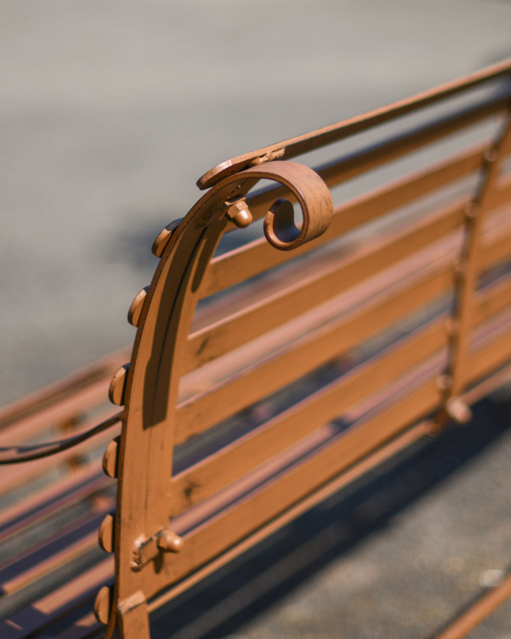 Ornate finishing on a rustic bench 