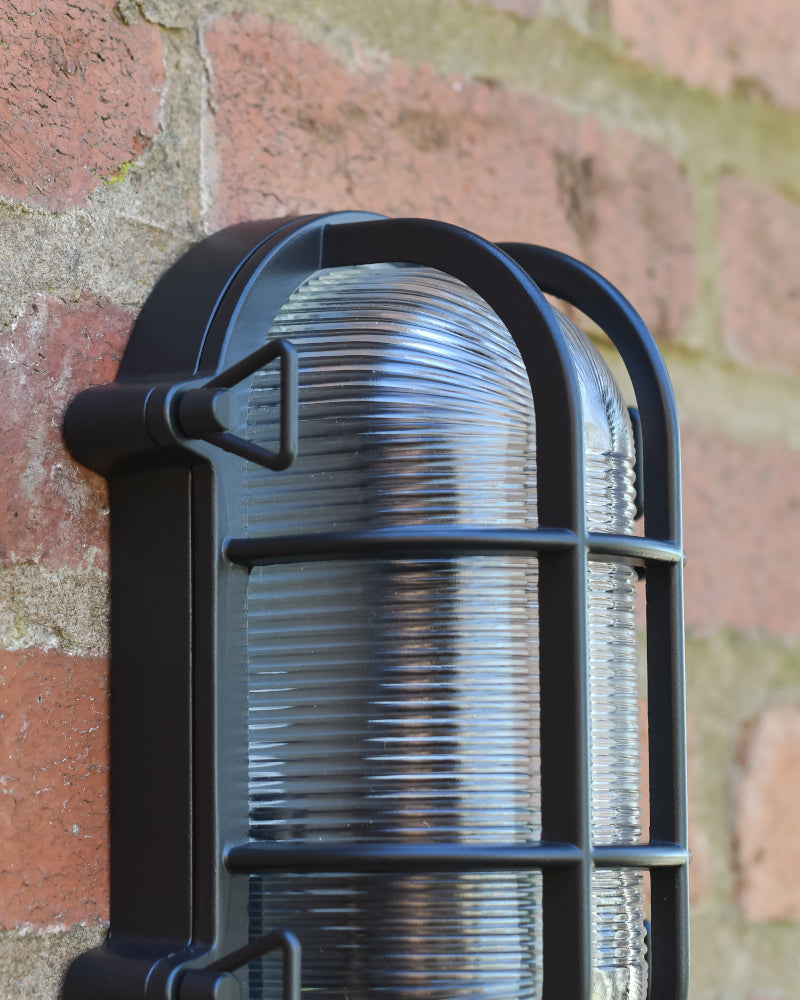 Close up of the top of the ribbed pane outdoor wall light