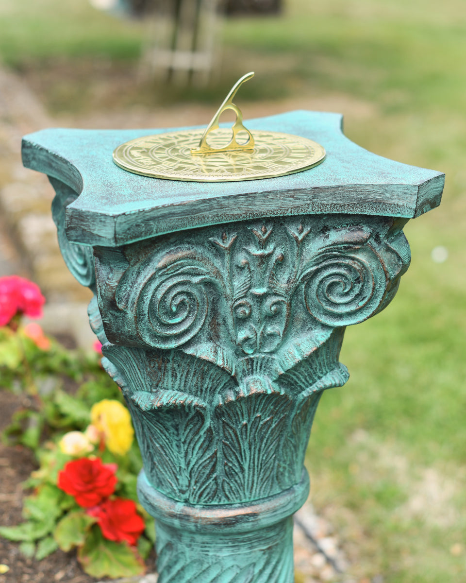 View of the leaf and scroll pattern at the neck of the pillar
