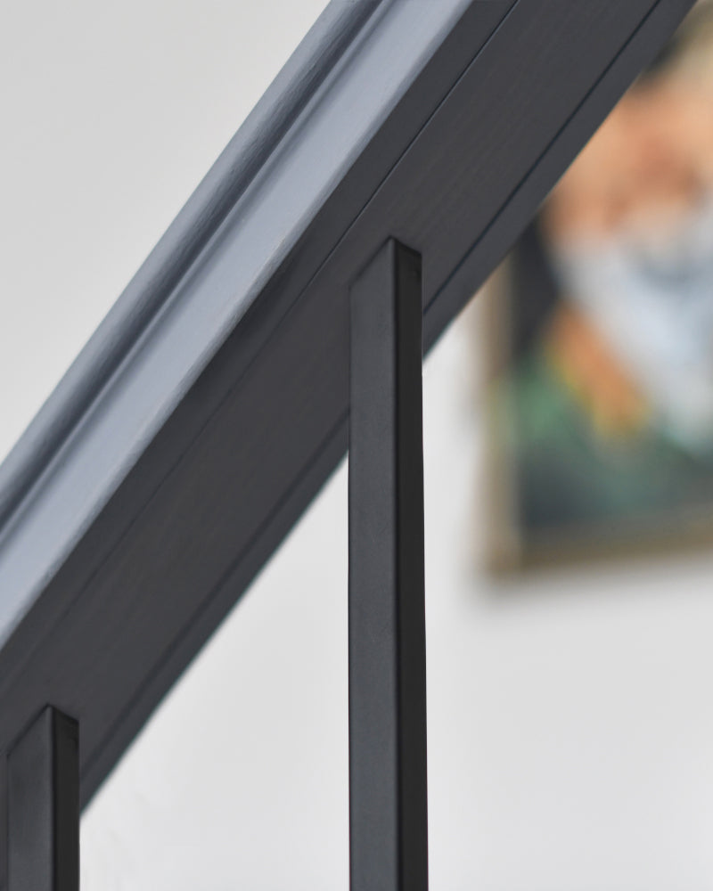 Close up of the spindle connected to the bannister