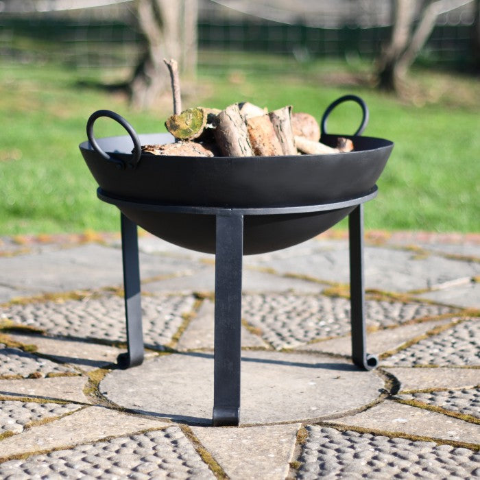 Contemporary Iron Kadai Fire Bowl in Situ Outside Containing Logs