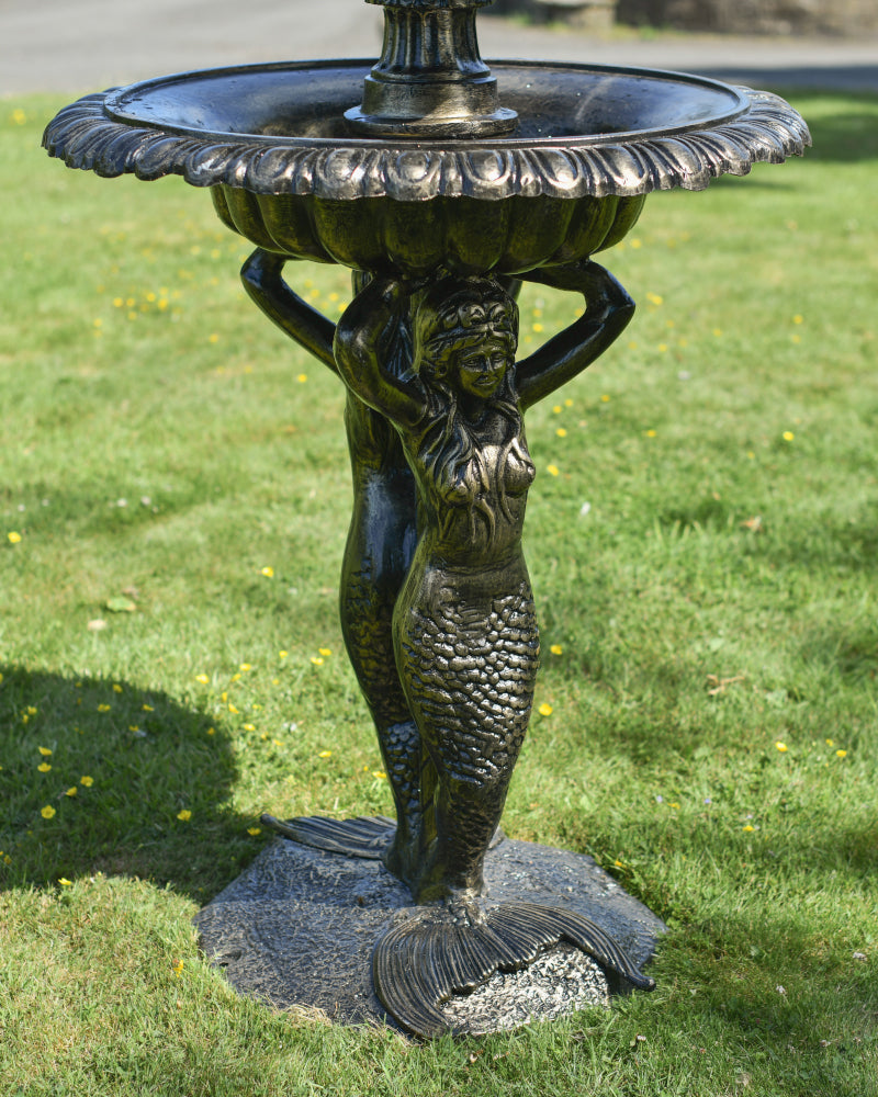 Close up of the mermaid suspending the water fountain