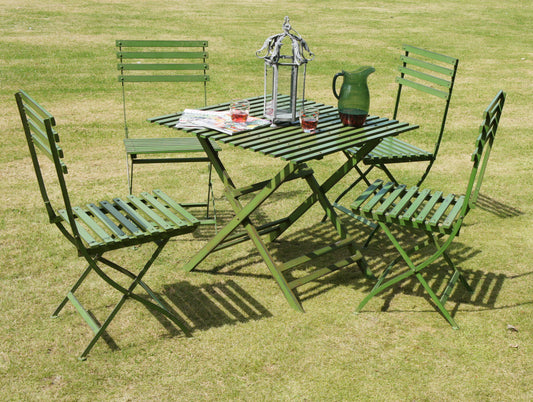 full set of green chairs and table on the grass