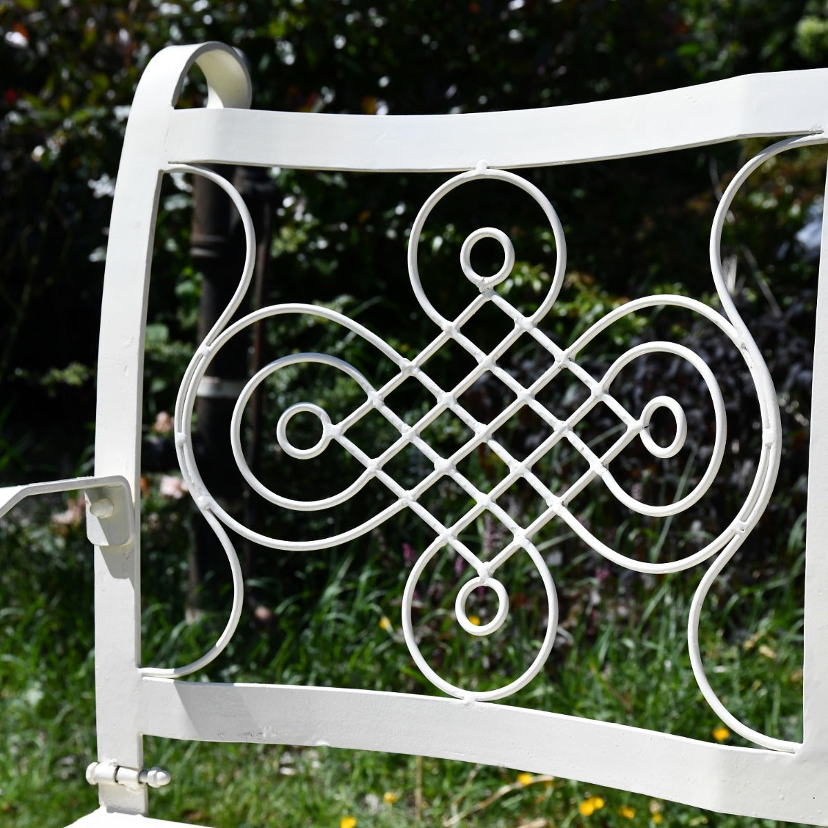 Close up of filigree detailing on backrest of The Devonshire Garden Bench
