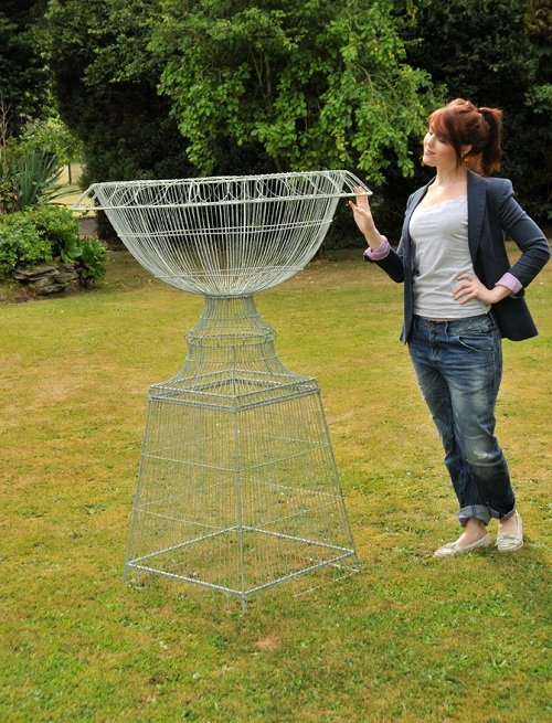 green wire planter with lady