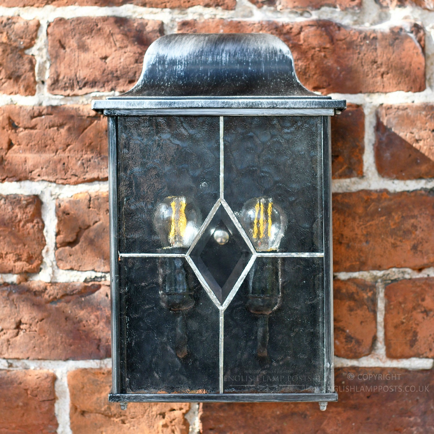 Hand Leaded glass panels on silver garden wall light