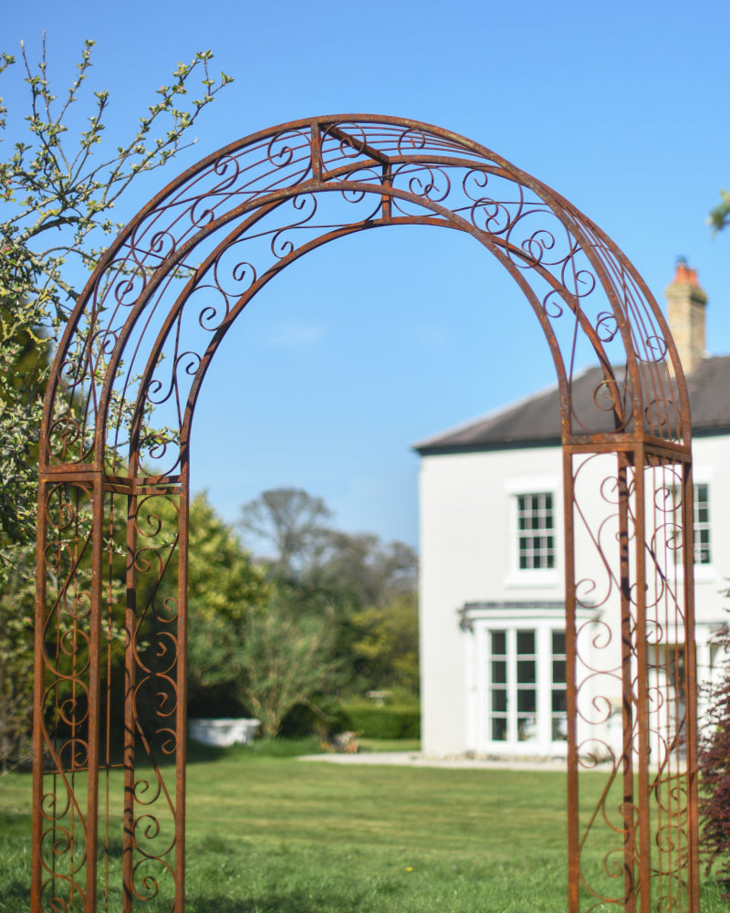 View of the rustic rose arch in the garden