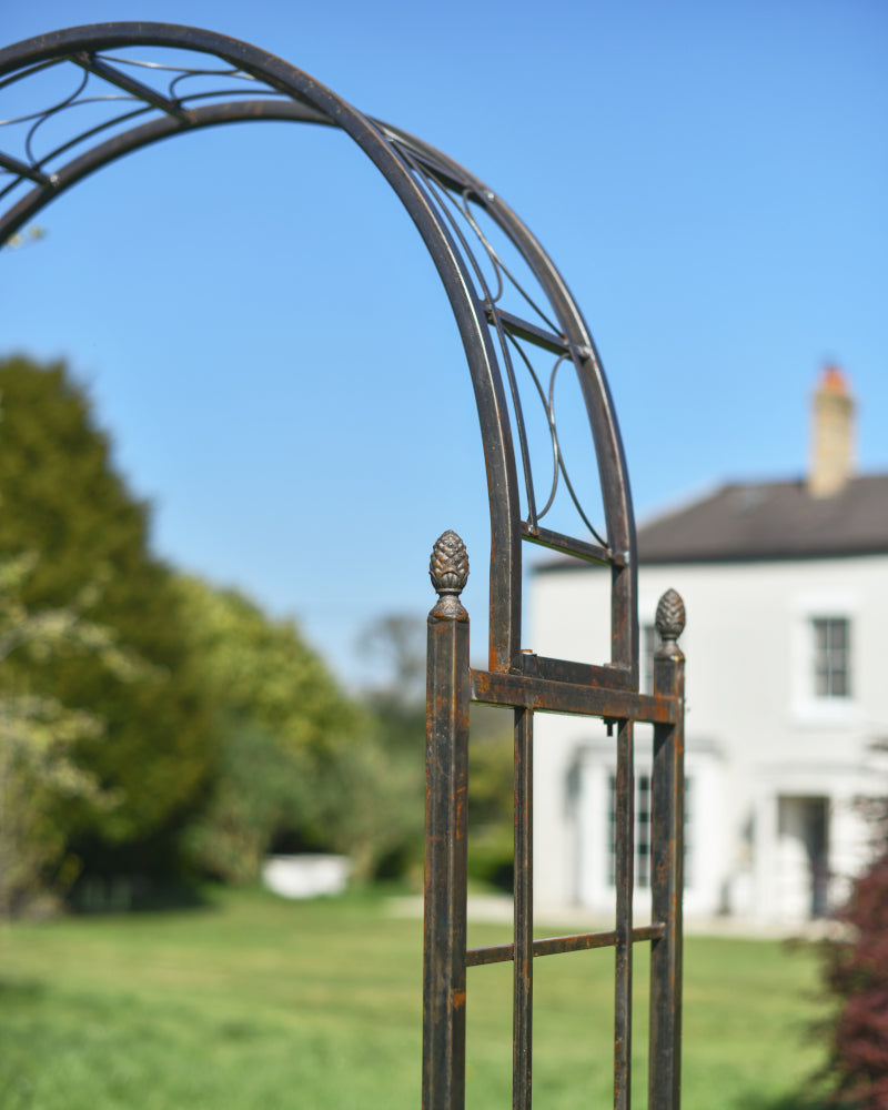 View of the scrolled top of the rose arch