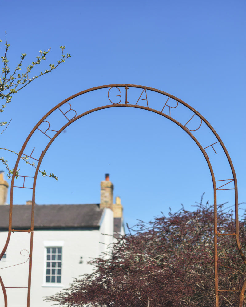 Close up of the 'Herb Garden' sign 