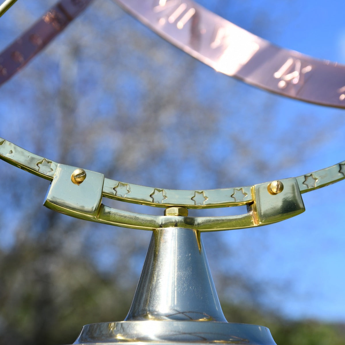 Close up of decorative finish on armillary sphere 