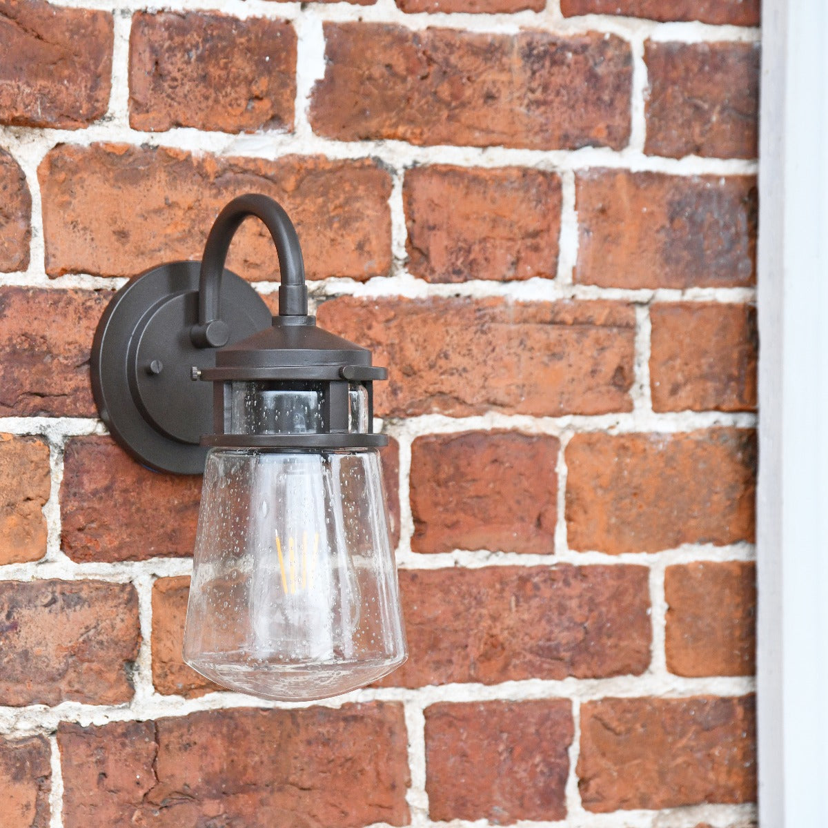 Industrial Lantern With Seeded Glass On Brick Wall