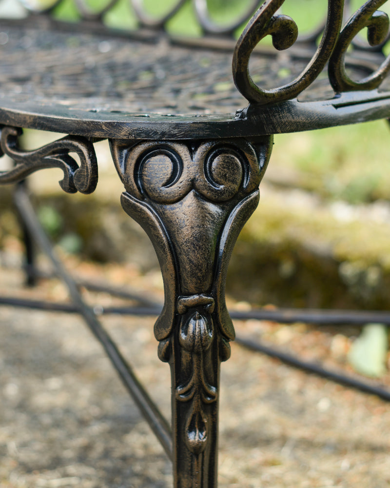 Close up of the decorated bronze bench leg