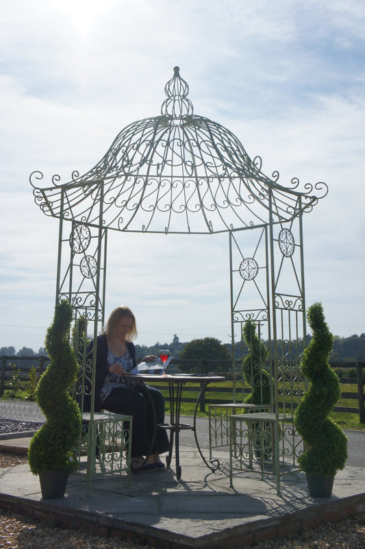 lady in garden gazebo