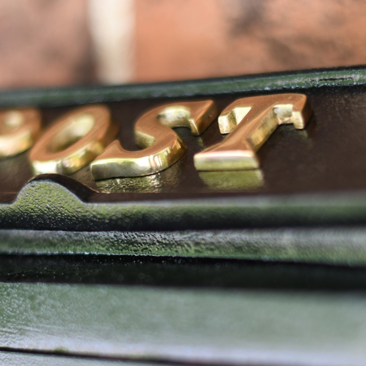 Close up of polished brass lettering 