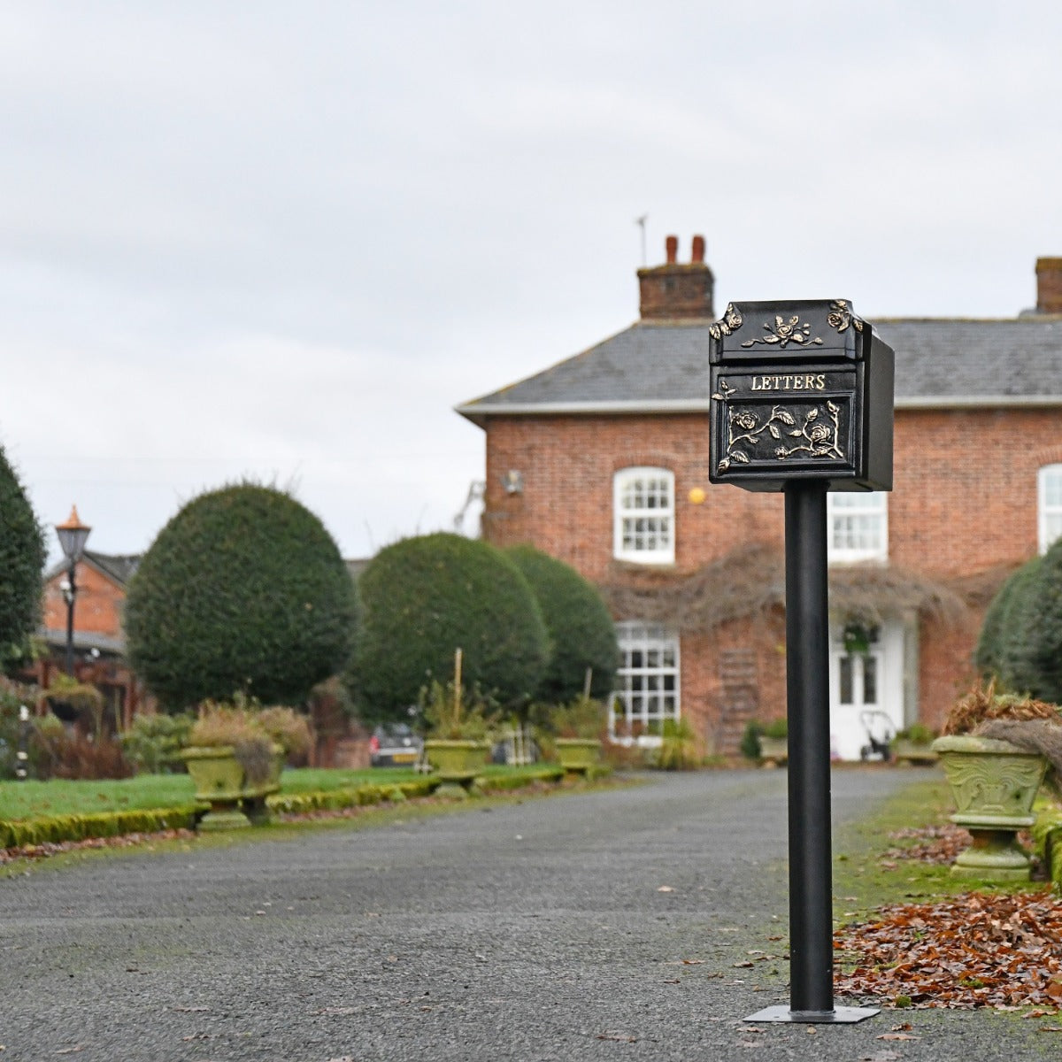 Finschester Post Box with Stand in driveway setting 
