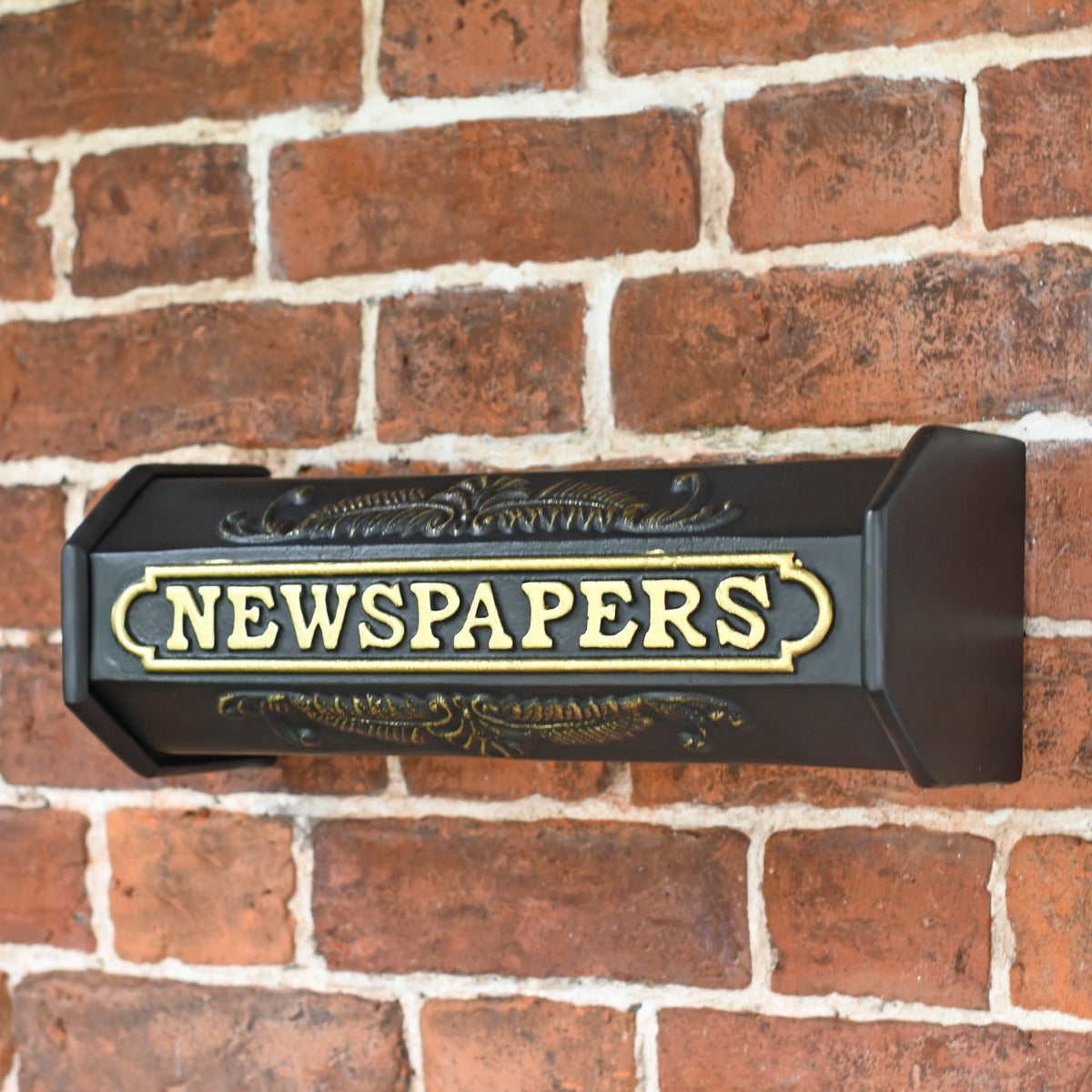 The Elizabeth Newspaper Holder mounted to wall 