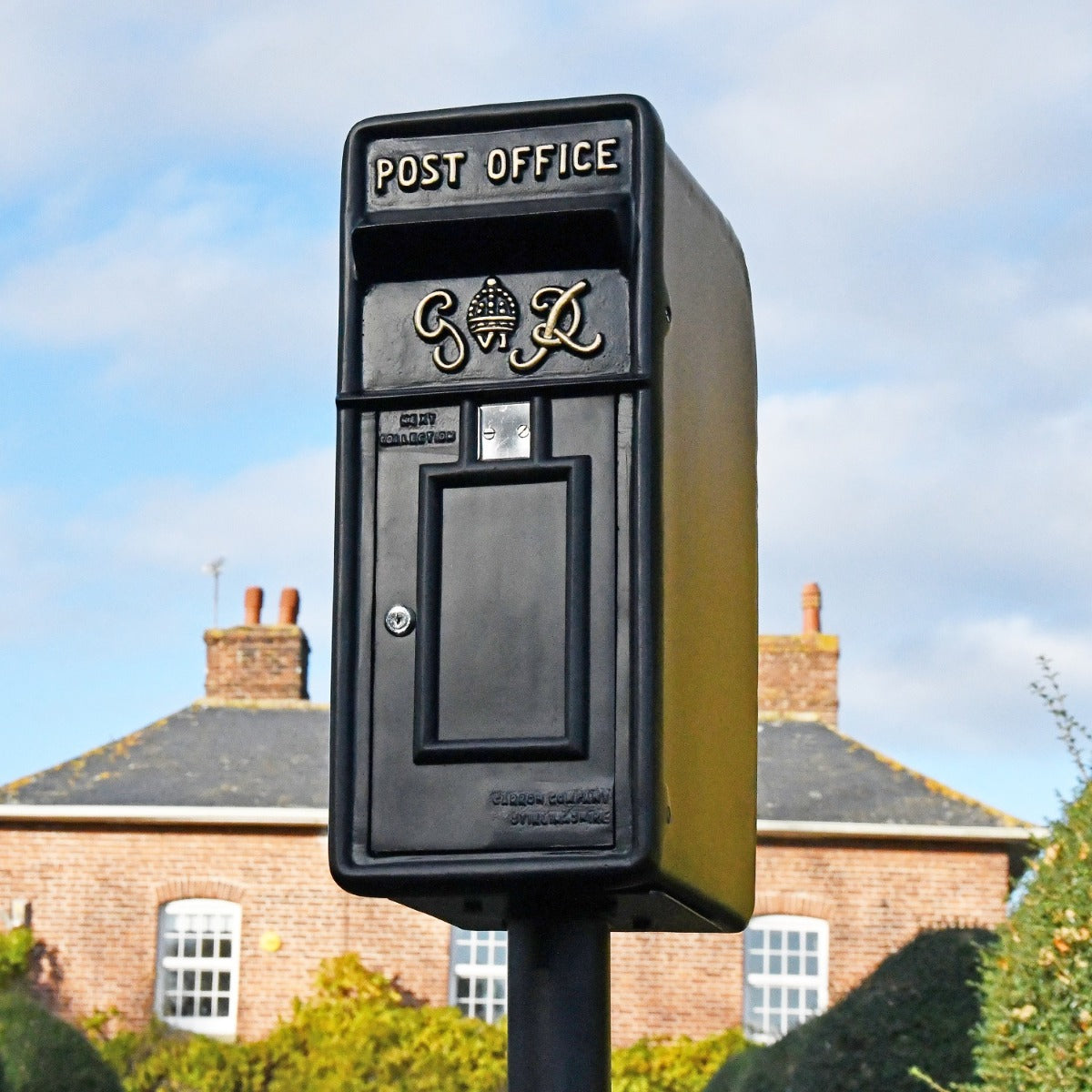King George black post box with gold lettering 