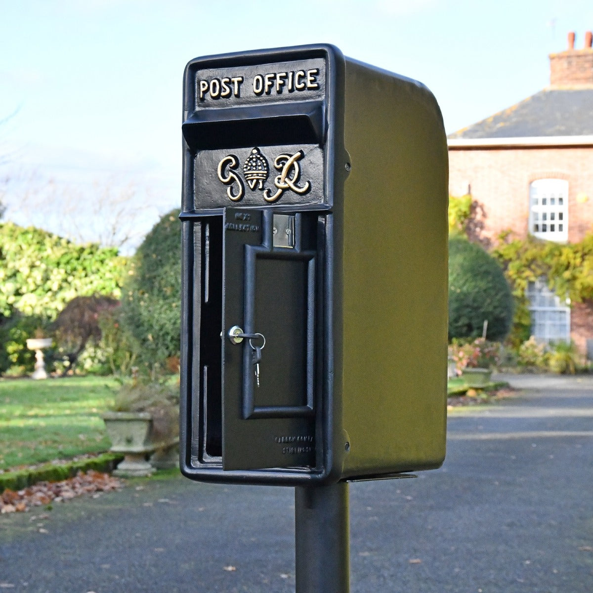 Black King George post box with lockable door open 