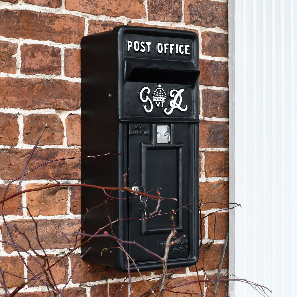 Wall Mounted Slim King George Post Box in Black with white lettering 