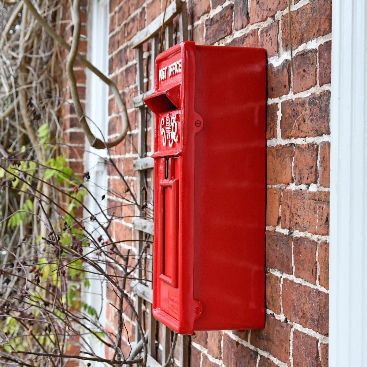 Side view of Slim King George Wall Mounted Post Box in Red