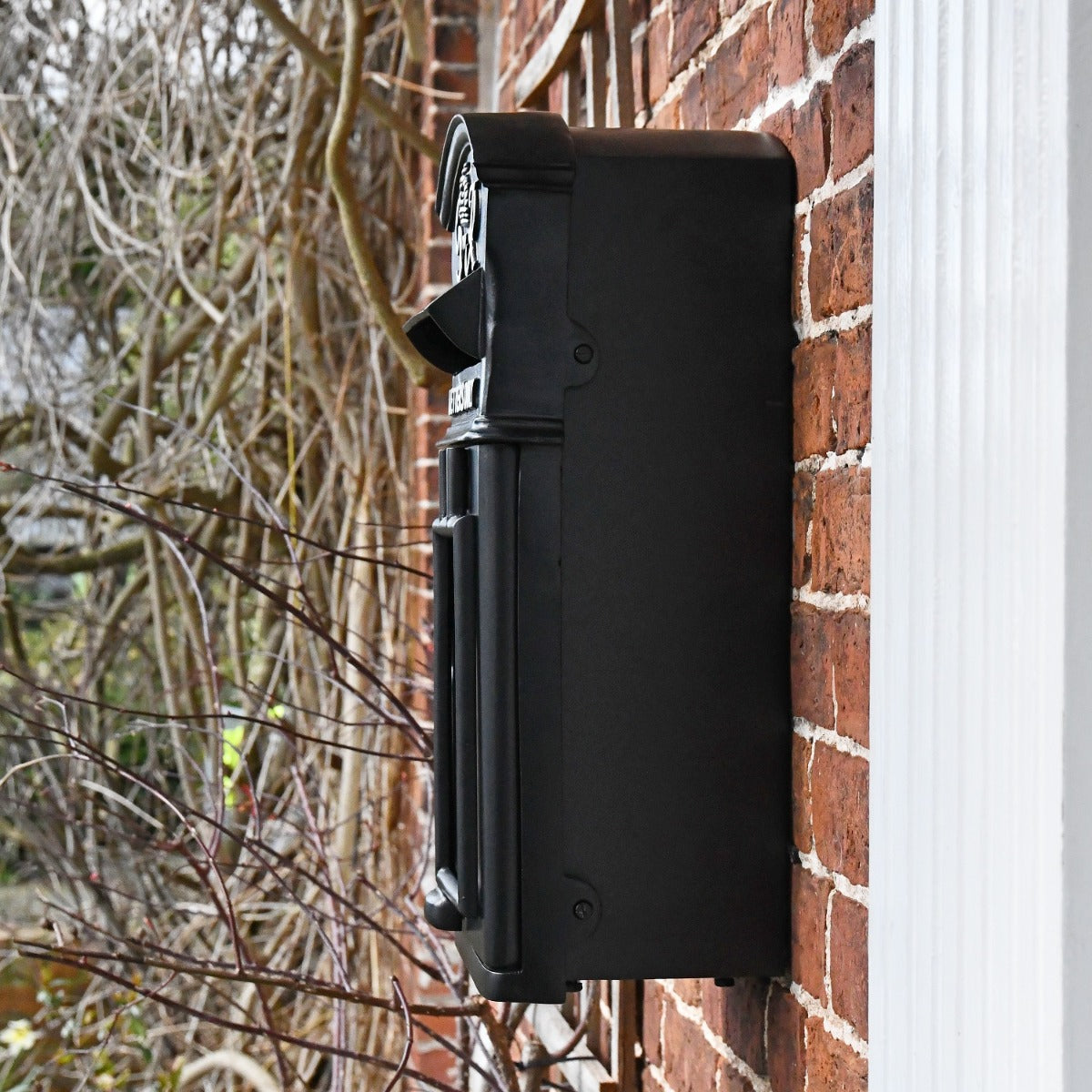 Side view of Black 'George Rex' Post Box mounted to wall 