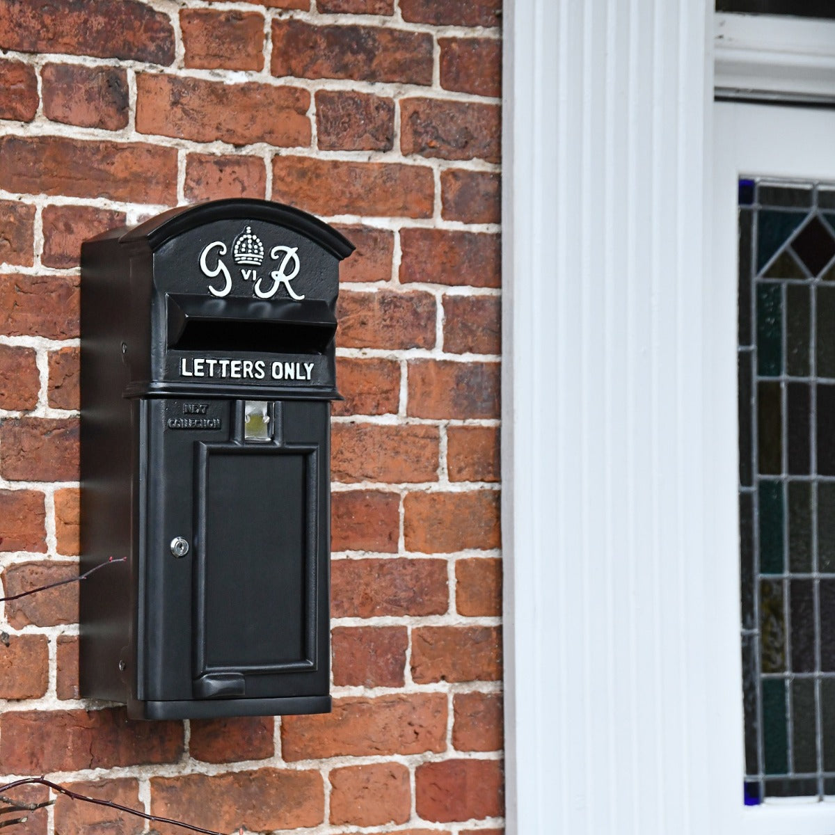 Black 'George Rex' Wall Mounted Post Box in Situ 