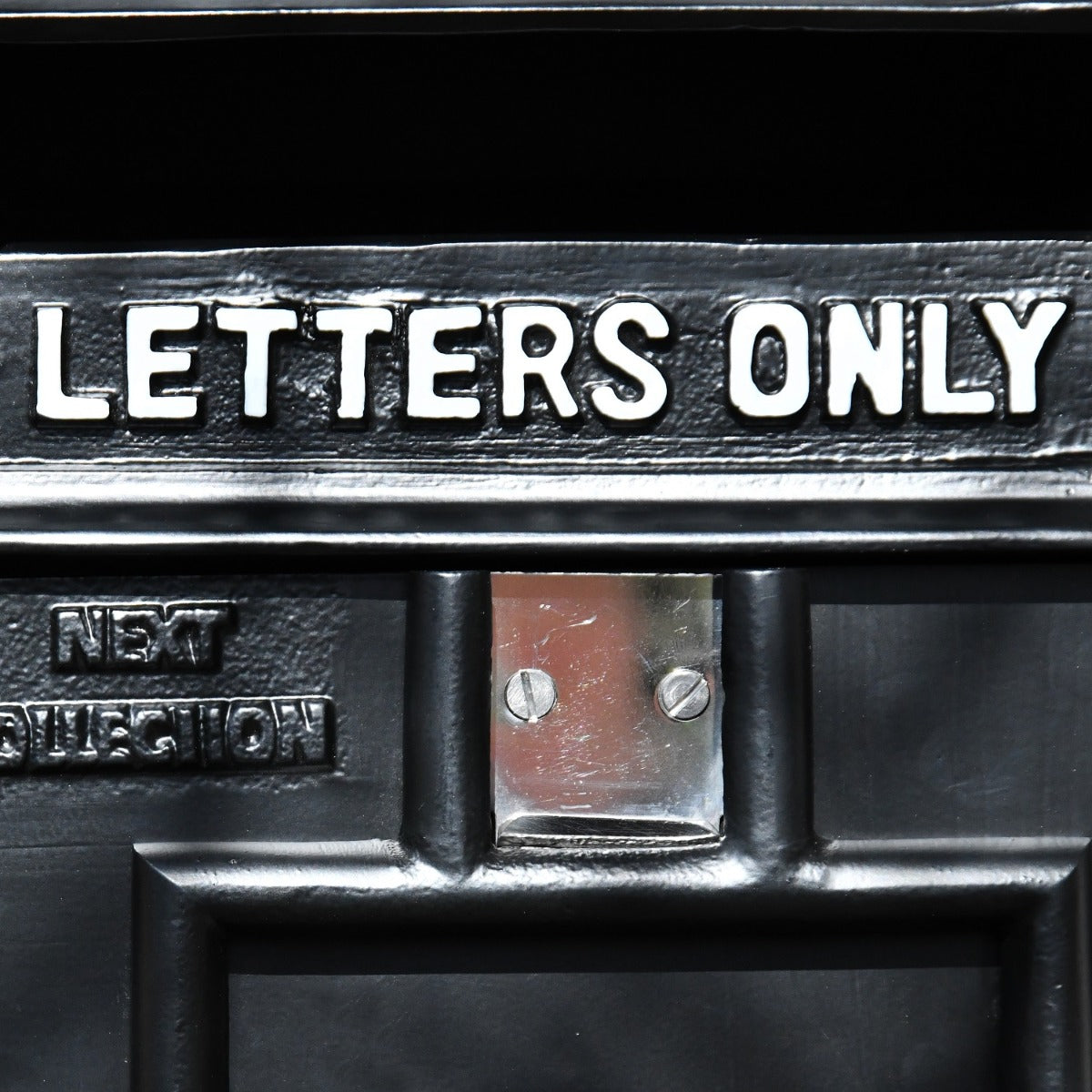 Close up of hand painted white letters 