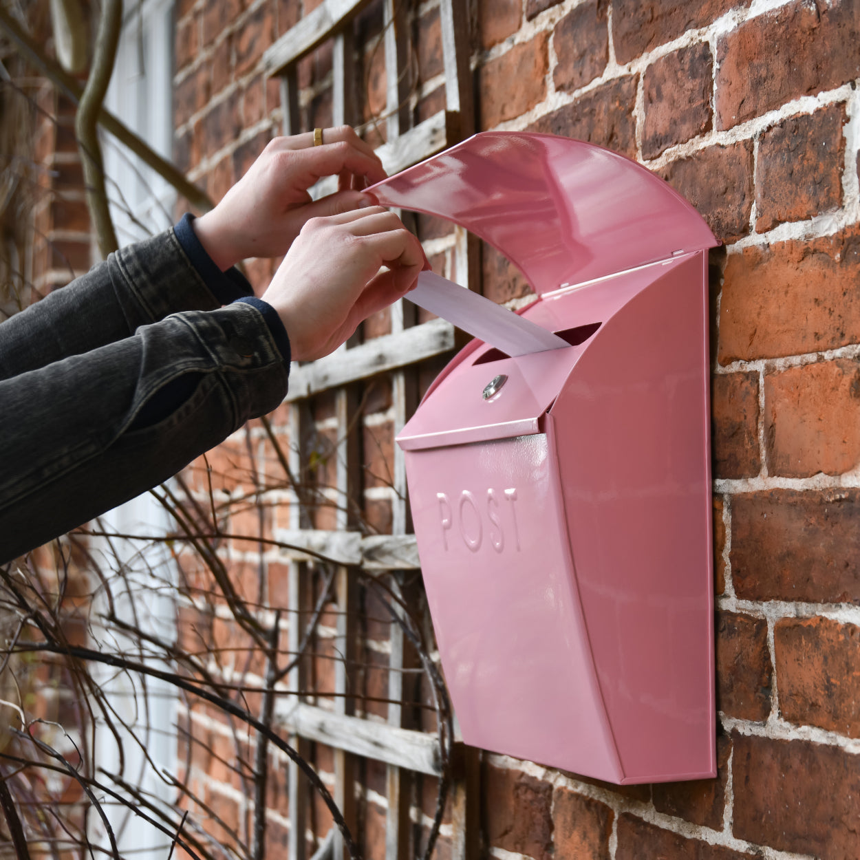Life size scale of the baby pink post box