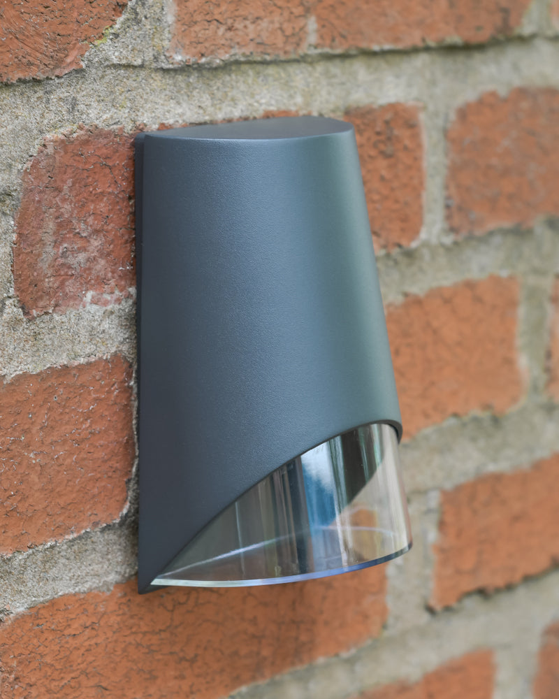 Three quarter view of the conical shaped wall light mounted 